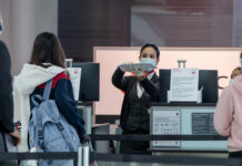 NEW COVID-19 SURGES KEEP TRAVEL RESTRICTIONS IN PLACE